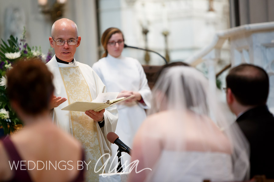 Bride and Groom listening to priest give the homily at Catholic Wedding in Pittsburgh